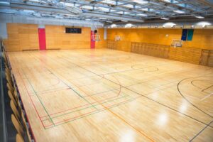 Best Indoor Basketball Flooring: Wood vs Synthetic Guide